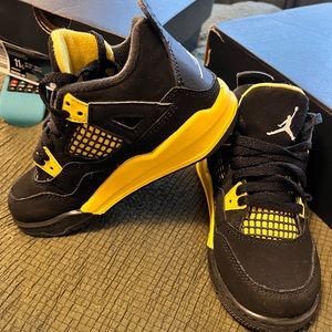 Jordan black and tour yellow 4s